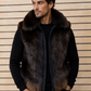 Man wearing a fur vest against a wooden panel background